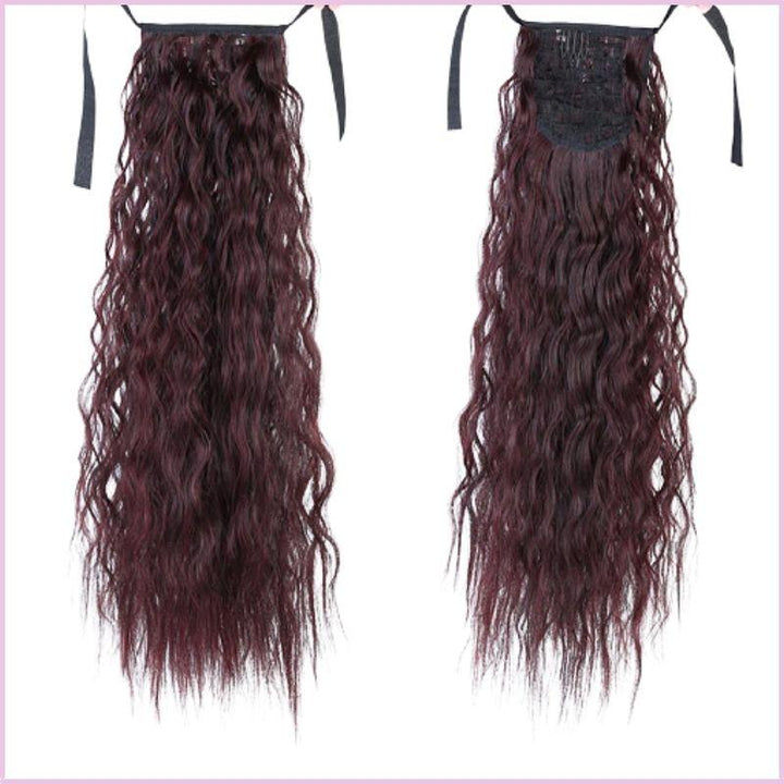 Postiche queue de cheval cheveux frisée auburn