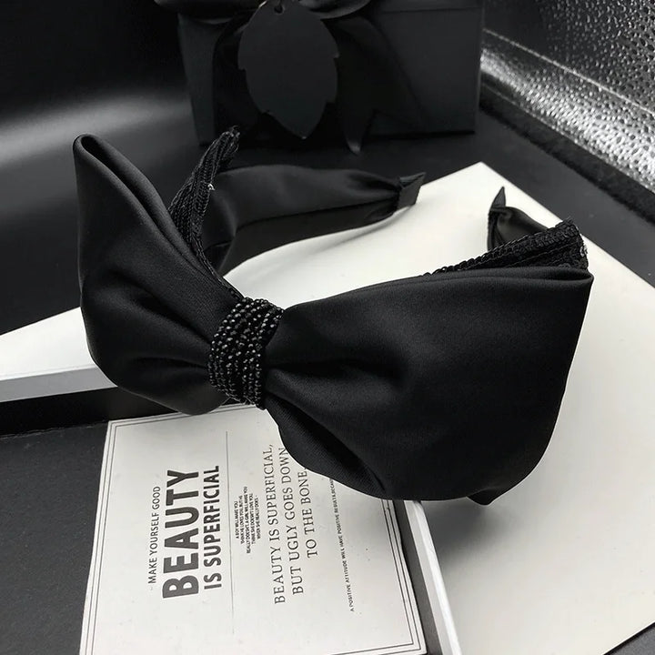 Serre-tête nœud satin noir élégant femme accessoire cheveux chic