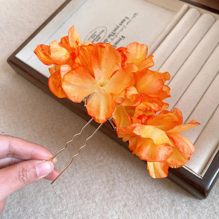 Épingle à cheveux fleurs orange bohème