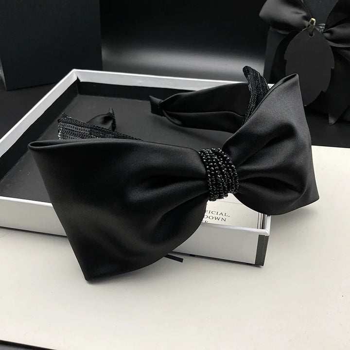 Serre-tête nœud satin noir élégant femme accessoire cheveux chic