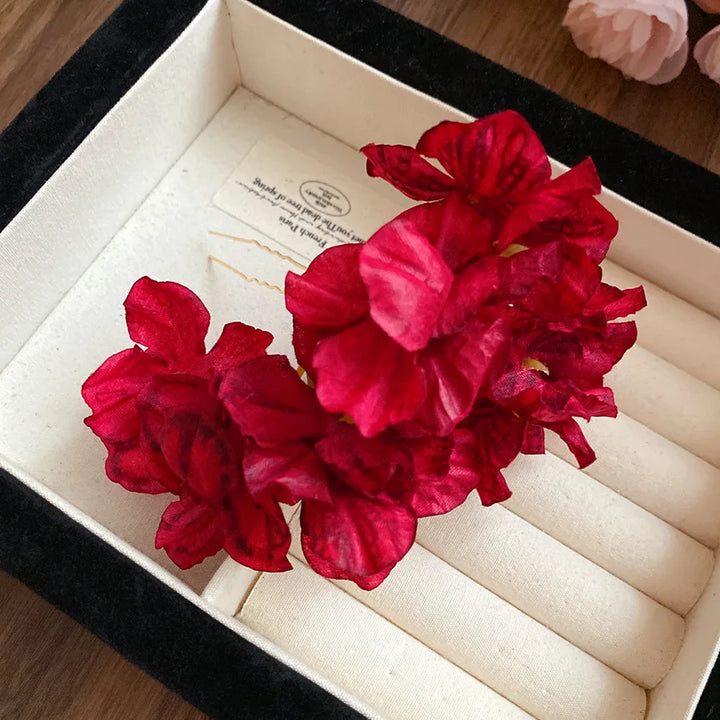 Épingle à cheveux fleurs rouges bohème